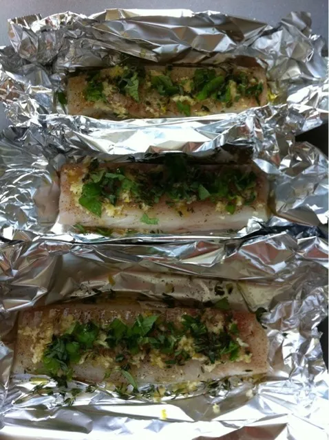 codfish with garlic, basil and olive oil in thin foil for the bbq|hubert rothさん