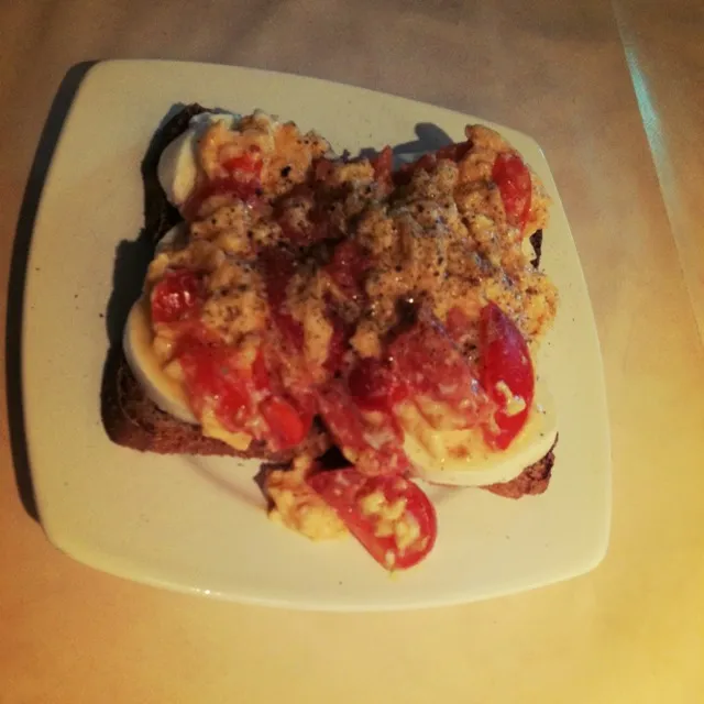 Snapdishの料理写真:scrambled eggs with tomato on bread with mozzarella cheese|triniさん