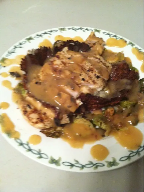 mustard chicken over dill redbliss mash in a parmesan cheddar bowl surrounded by spicy pepper onion brussels covered in beer apple wine gravy|eli connartonさん