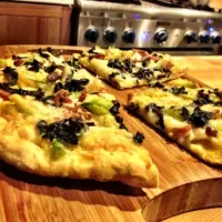 onion, brussel sprouts, squash puree base, bacon, truffle oil & cheeses pizza|mathilde goldschmidtさん