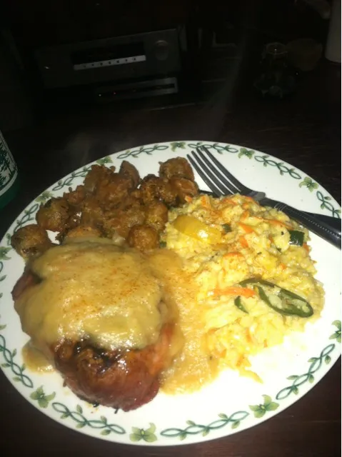 raspberry pomegranite marinated grilled pork chop topped with habenero applesauce with beer battered brussels sprouts and veggie risotto|eli connartonさん