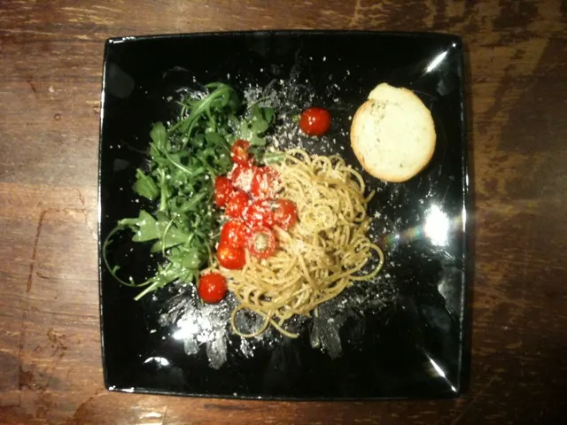 Snapdishの料理写真:Pasta with Pesto and Parmesan Cheese in a nest of Ruccola Salade and fresh Cocktail Tomatoes|Christianさん