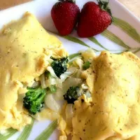 Omelet with broccoli, onion, cabbage, & cheese