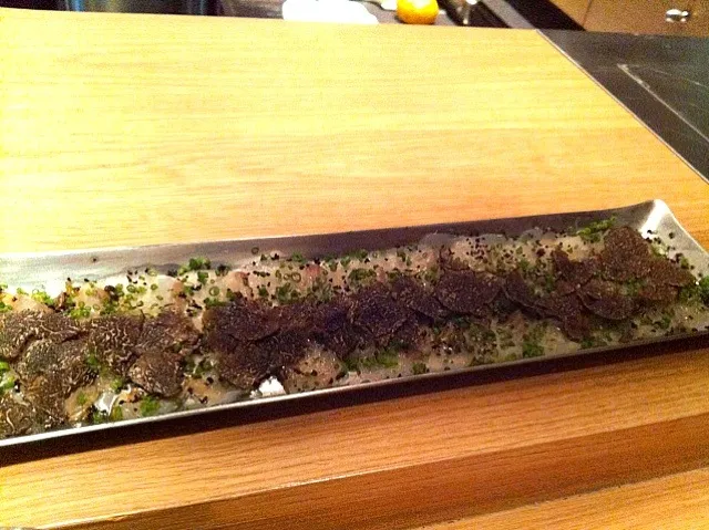 Tai Carpaccio - Thinly sliced snapper with black truffle and chives|hardwi satrio pinandityoさん