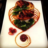 Garlic kissed grilled chicken with cranberry oyster sauce on a bed of rice.