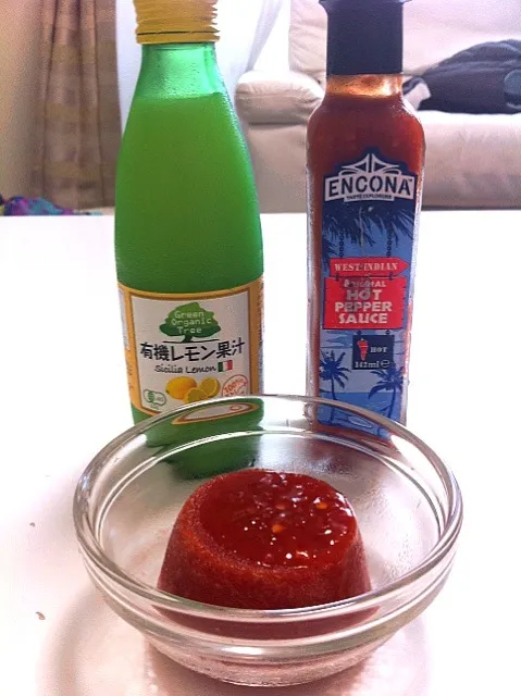 Snapdishの料理写真:Frozen canned diced tomato with Leigh's hot sauce and lemon juice!|たけうちさん