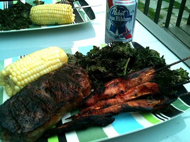 new york strip, kale, corn and pork satay.|ryan goldenさん