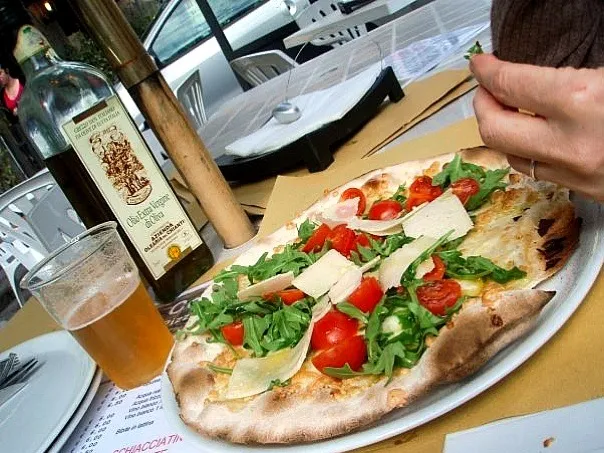 Arugula, Cherry Tomatoes, & Parm drizzled with local olive oil on crispy flat bread|Luci Zoeさん