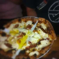 Pizza with eggs and pancetta|lisa maloneyさん