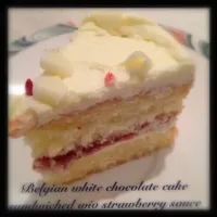 Belgian White chocolate cake sandwiched wiv strawberry sauce