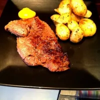 Steak with garlic and rosemary new potatoes