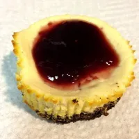 Snapdishの料理写真:Mini Black-Bottom Cheesecakes with Raspberry Glaze|Andrea Vibbertさん