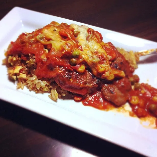 Snapdishの料理写真:Baked pork chop with mozzarella cheese over egg fried rice with tomato sauce|janice Williamsさん