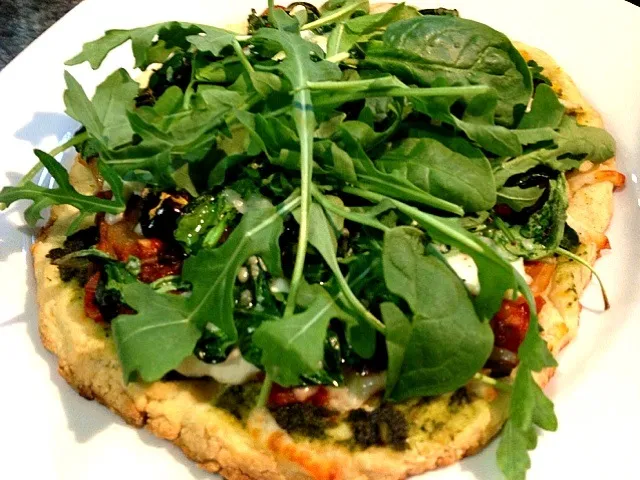 Snapdishの料理写真:Homemade crust with pesto, ricotta, asiago, mozzarella, mushrooms, onions, tomatoes, kalamata olives, spinach and arugula.|summerさん