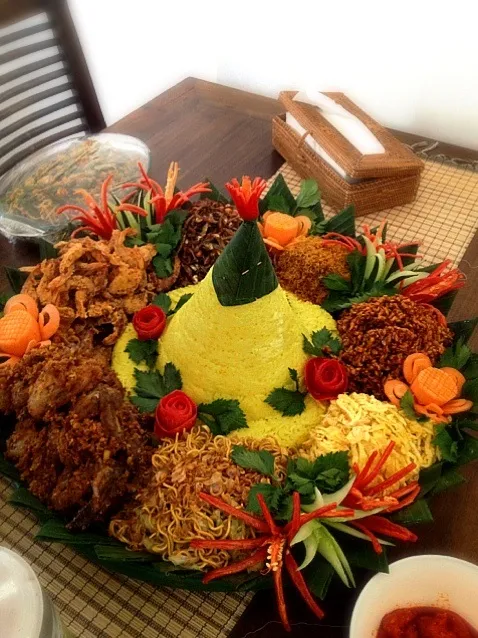 Snapdishの料理写真:Tumpeng with yellow rice|Iriani Irenne Thamrinさん