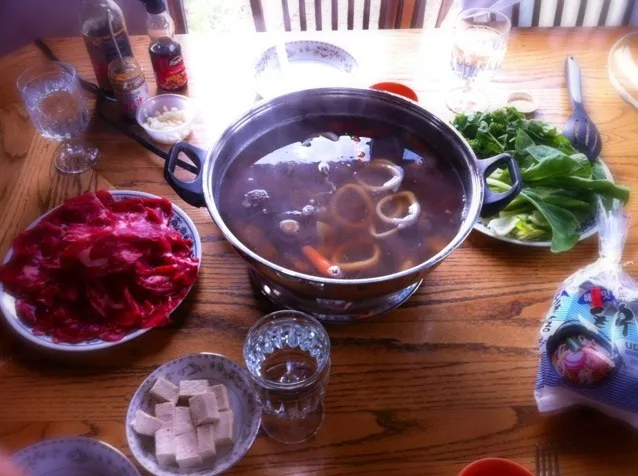 Snapdishの料理写真:Chinese hot pot - ribeye, greens, squid rings, tofu, mushrooms, carrots, potatoes, and onion in a beef broth|WMWさん