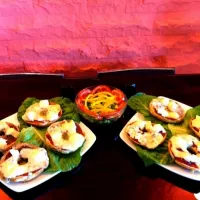 four types of cheese Toast on a pepper sauce and cucumber tomato and yellow pepper salad|shay omradさん