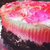 Snapdishの料理写真:Choc cake with garnach covered with buttercream rossettes sprayed with red and pink  mist. Base covered with crushed oreo...rich much?|nur diyanah magnessさん