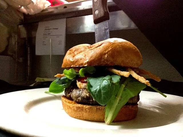 Snapdishの料理写真:Black truffle stuffed burger with house made Boursin cheese, bourbon molasses glaze, and shaved tobacco fried onion rings on a brioche bun.|valintinus domingoさん