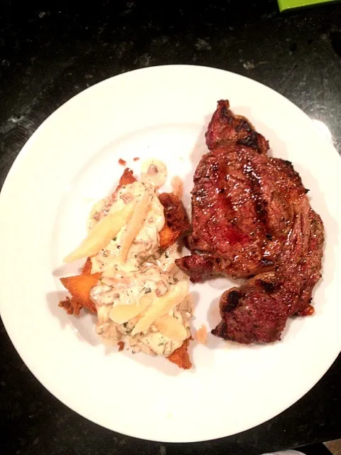 Rib eye with fried polenta topped with porcini cream sauce and shaved parmeggiano|ernest ristiさん