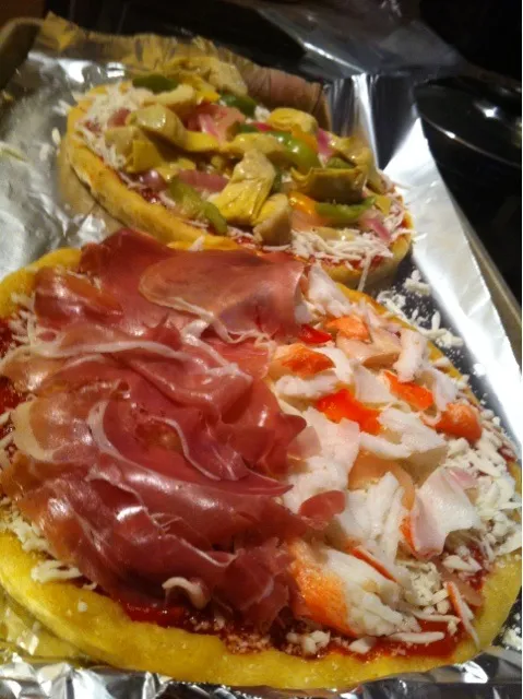 Snapdishの料理写真:Homemade prosciutto, crab, and Mediterranean pizzas on cornmeal crusts|kate tannuraさん