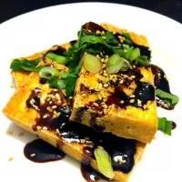 Snapdishの料理写真:Pan-fried tofu with dark sweet soy sauce|trina phamさん