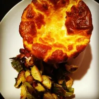 Cheese soufflé with a warm salad of roasted brussel sprout, garlic and maple smoked bacon.|Meredith Humbrachtさん