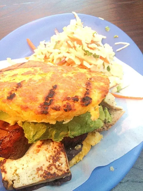 Sweet yellow corn arepa filled with tofu, black beans, plantains, and avocado|monica szepesyさん