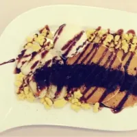 Snapdishの料理写真:Pancakes with honey stars, crushed oreo, bananas, vanilla ice cream & choc syrup|Evangelyn.さん