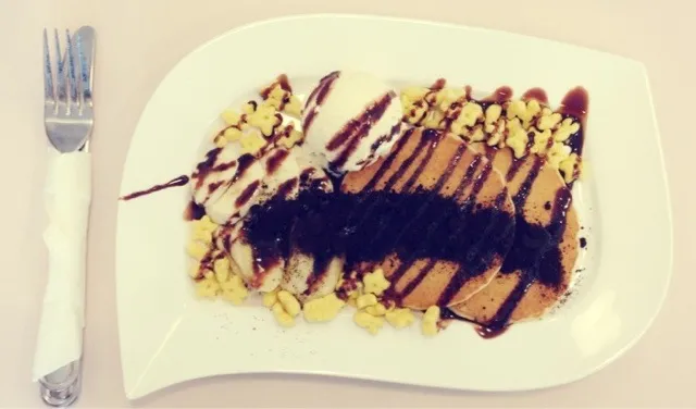 Snapdishの料理写真:Pancakes with honey stars, crushed oreo, bananas, vanilla ice cream & choc syrup|Evangelyn.さん