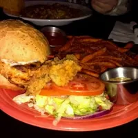 voodoo spicy chicken sandwich with fried pickles, pepperjack cheese, tomatos, and lettuce. oh and voodoo sauce of course.|Taylor salyersさん