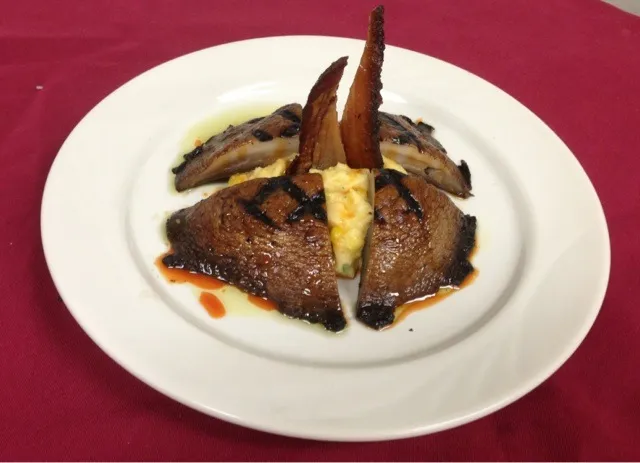 Grilled portobello, roasted corn polenta, carrot syrup & basil oil.|mark seibertさん