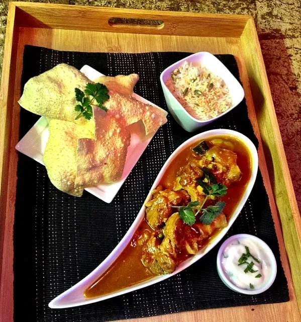 Lamb curry served with fresh yogurt and mint dip. Cardamon and almond rice and pompadoms on the side|Lemar Olivierさん