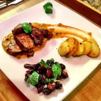 Snapdishの料理写真:Grilled rump in a spice barbeque and green peppercorn sauce, served with potatoes fried in duckfat and grilled balsamic tomatoes and basil on the side|Lemar Olivierさん