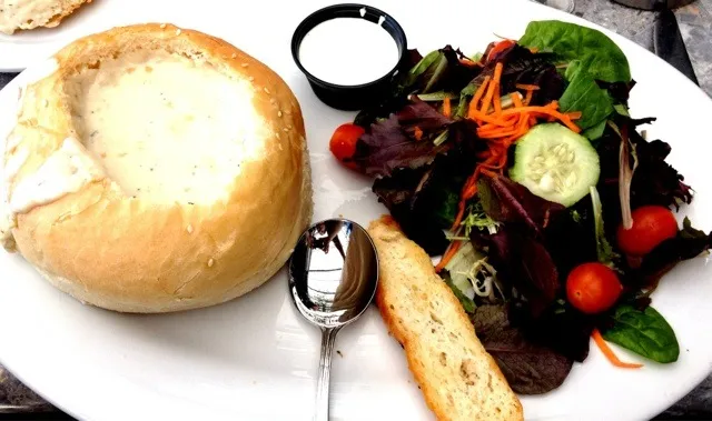 Snapdishの料理写真:Clam Chowder in a Bread Bowl with a Salad from Tony P's|sooprcoolchicaさん