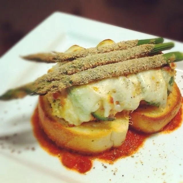 Spicy Chicken Parmesan with Avocado served with garlic Texas toast and lightly breaded asparagus.|Brian Churchillさん