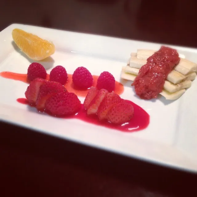 Snapdishの料理写真:Sliced strawberries on a raspberry wine reduction sauce, raspberries on a strawberry wine reduction sauce sliced bananas topped with strawberry puke. And an ora|Brian Churchillさん