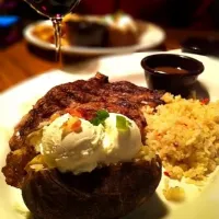 Snapdishの料理写真:Medium Angus Ribeye Steak with Loaded Baked Potato and Rice Pilaf. Premium House Red.|Jerry Leeさん