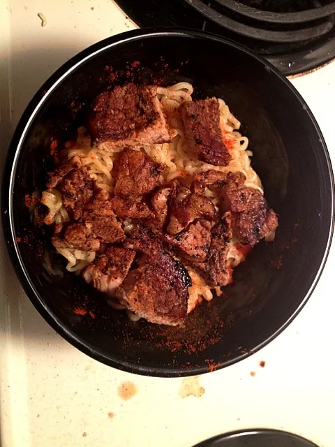 Snapdishの料理写真:Ramen noodles topped with marinaded pan seared pork chops.  With a sprinkle of paprika.|josh avilesさん