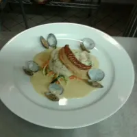 lemon sole, trout mousse, cream fish sauce, sauteed vegetables &  clams|Sam shawcrossさん