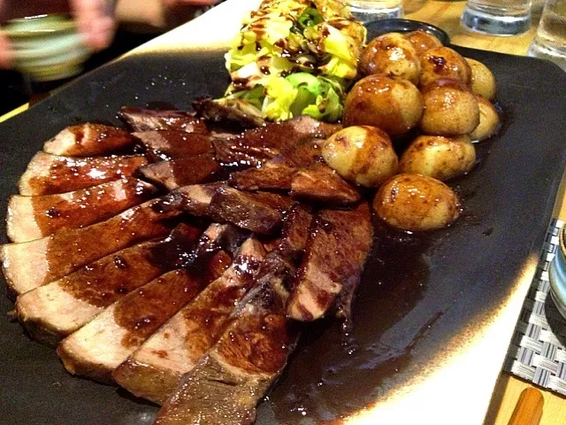 Beef tongue steak with garnish potatoes and cabbage|do dyuさん