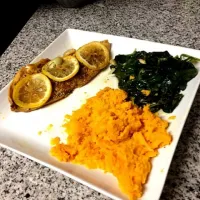 Oven steamed tilapia with sweet potato and garlic infused spinach.|kyliさん