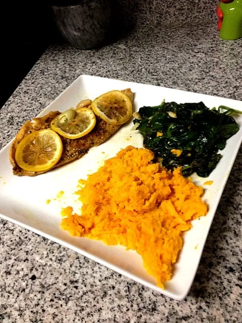 Oven steamed tilapia with sweet potato and garlic infused spinach.|kyliさん