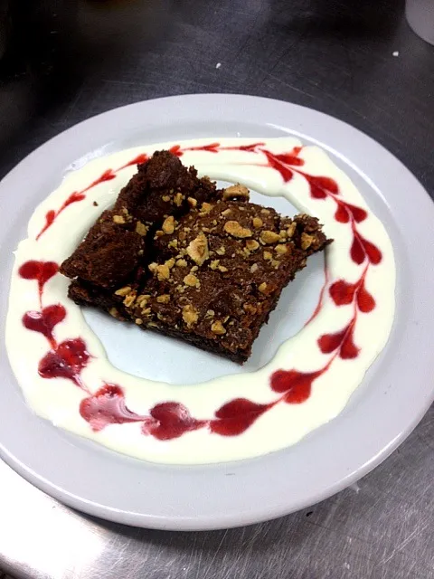 Snapdishの料理写真:Hazelnut fudge brownie with cream cheese and cherry sauce|Steven Turknettさん