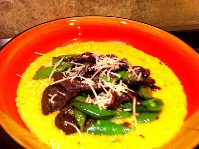 Creamy polenta topped with mushroom ragu, sugar snap peas and parmesean|virginia frasseさん