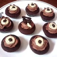 Snapdishの料理写真:Chocolate cupcakes with Mocha frosting & melted chocolate decor|kaushaさん