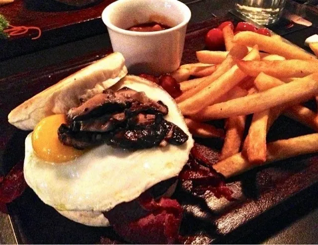 Snapdishの料理写真:All day breakfast burger served with fries and baked beans.. Mmm.. Mmm.. Mmm..|Mei Meiさん