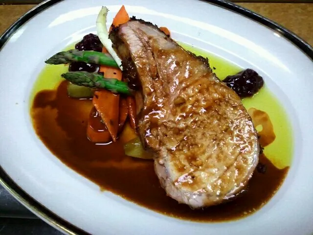 Snapdishの料理写真:Pork chop with lingonberry relish asparagus carrots chayote with ancho chili chocolate broth and mint oil|Jacki Carterさん