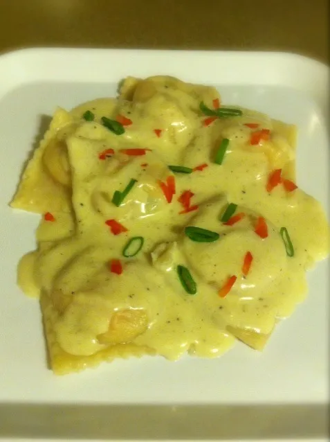 Snapdishの料理写真:Shrimp and Grits Ravioli with a black pepper cream sauce|Mark Nataliさん