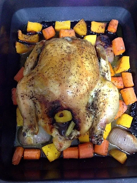 One dish dinner - roast chicken stuffed with garlic lemon and lemongrass on a bed of carrots butternut squash and onions|Ong Sor Fernさん